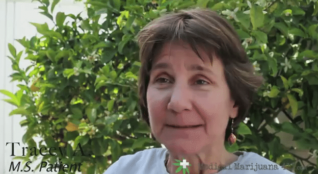 Tracey A., an MS patient, interviewed outdoors in front of green foliage